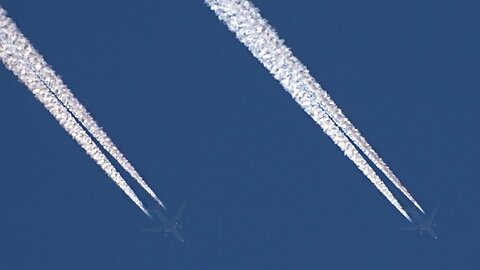 Racing airplanes with plane trails side by side contrails 11-3-2023