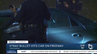 Stray bullet hits car window on 94 freeway
