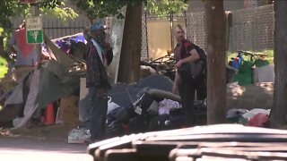 Homeless camp cleanup underway near Morey Middle School