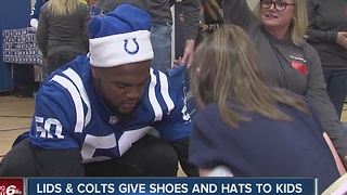 LIDS and Colts give shoes and hats to kids at Hawthorne Elementary School