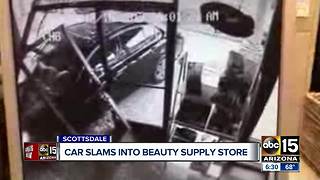 Car slams into beauty supply store