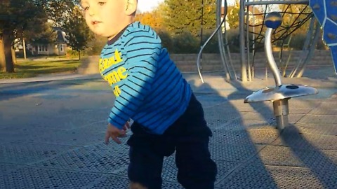 A Little Boy Is Super Dizzy After Riding A Merry-Go-Round