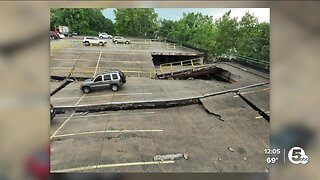 Parking garage collapses, cars overturned
