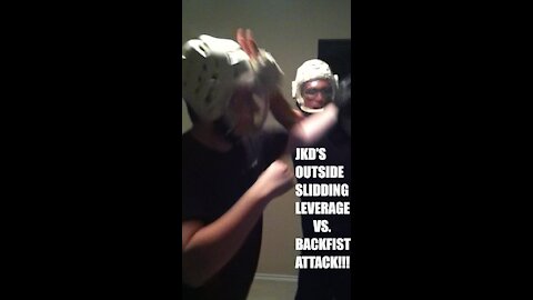 JKD'S OUTSIDE SLIDING LEVERAGE VS. A BACKFIST ATTACK!!!
