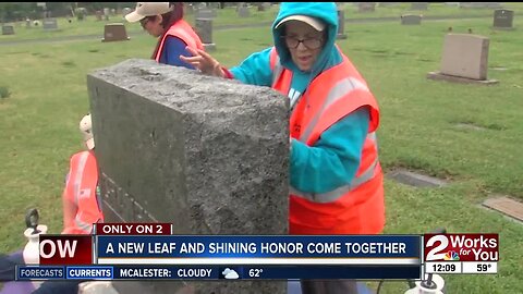 Women with disabilities clean veterans headstones