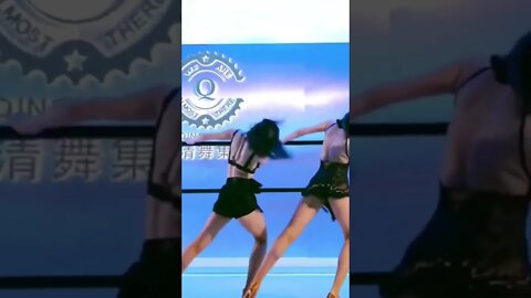 Two Slender Chinese Girls Dance In Perfect Synchronization