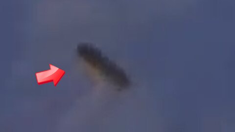 Brown stick-shaped UFO photographed from the ISS