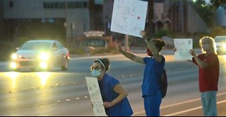 Vegas nurses hold 'Patients before profits' signs