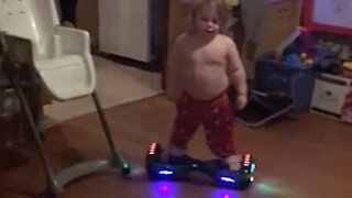 Two-year old totally bosses hoverboard!