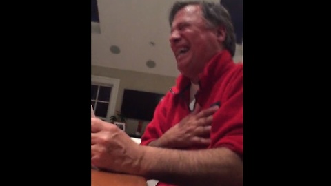 Dad's reaction to adult card game results in hysterical laughter