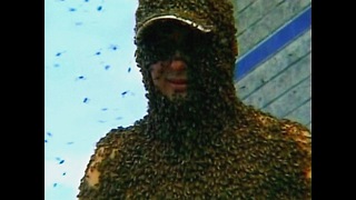 Guy Covered in 500,000 Bees