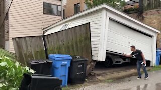 Fallen tree totally uproots garage in Chicago ally