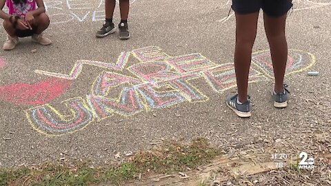 Chalk the Walk event in Gambrills in response to hateful comments made toward children of color