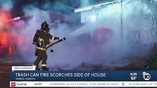 Trash can fire scorches side of Normal Heights home