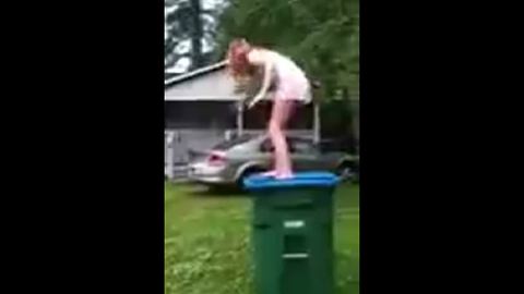 Girl Falls Of The Trash Can