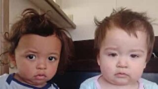 Baby twins trapped inside cupboard