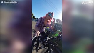 Parrot enjoys bicycle rides with owner