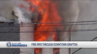 Firefighters battle large fire as building collapses in downtown Grafton