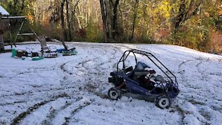 My 6 yr old and his Hammerhead go-cart in the snow