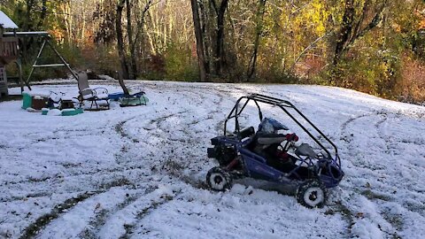 My 6 yr old and his Hammerhead go-cart in the snow