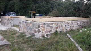 Building a beautiful cabin with logs - part01 - foundation and stone wall