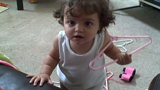 An Adorable Toddler Girl Has A Hanger Stuck In Her Hair