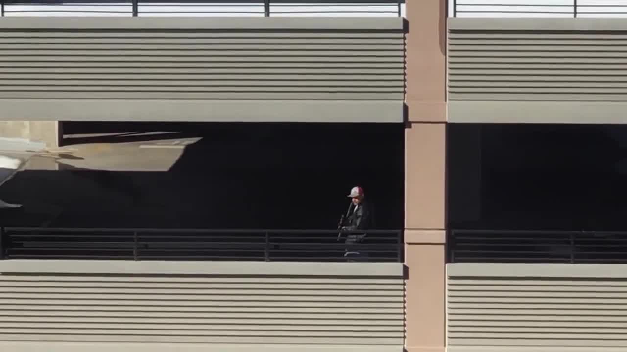 RAW: Man armed with a rifle pacing back and forth in Denver parking garage