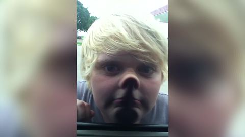 Young Boy Makes Funny Faces With A Twist