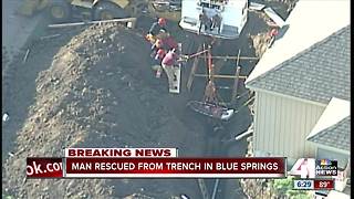 Crews rescue man from trench