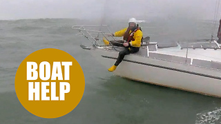 Lifeboat crew struggle to save stricken yacht