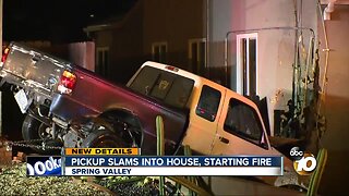 Pickup slams into house, starting fire