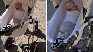 Baby Preciously Lays On His Stomach During Stroller Ride