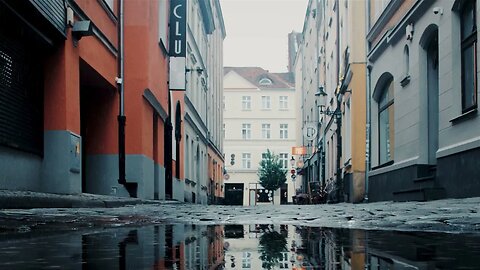 Rain on the cobblestones of Mokra street in Poznań, Poland