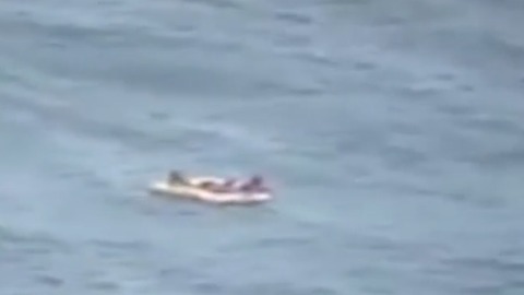 Men rescued after boat capsizes