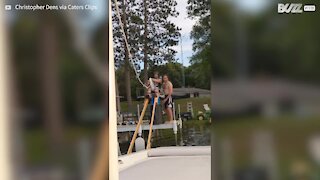 Crazy guy water skis on stilts