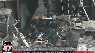 Fire damages garage at home in Lansing