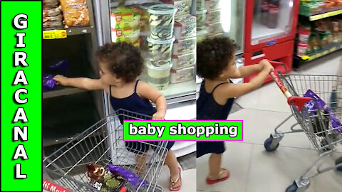 beautiful baby doing shopping! 3 years old and already knows how to choose