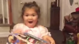 Little girl totally freaks out over Christmas present