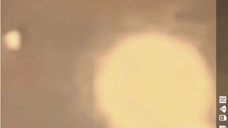 close sphere UFo flys over/ cloaks