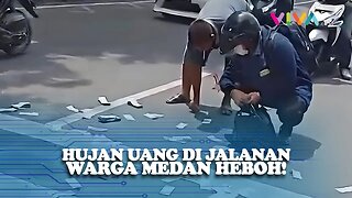 Bikin Melongo, Uang Berserakan di Jalanan Kota Medan