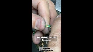 Hand making an emerald tennis necklace with 110 princess cut stones