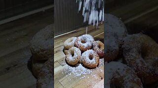 Powdering Donuts With Powdered Sugar