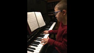 Musically gifted child plays Joy to the World on the piano!