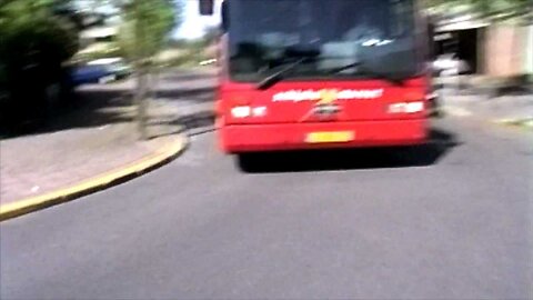 scooter almost crashes at bus