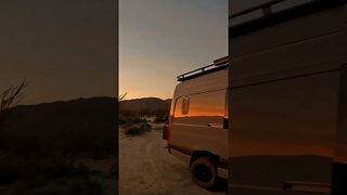 Campfire in the desert at sunset