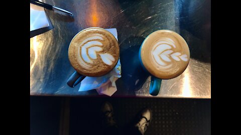 Take away flat white with amazing latte art to the finish
