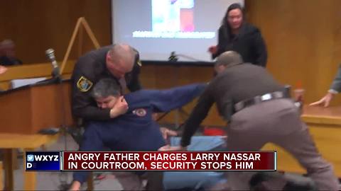 Father attacks Larry Nassar in court