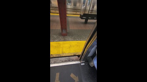 R train at the Times Square subway platform. May 21, 2024 at 12:15 PM.