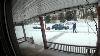 A Man Shoveling Snow