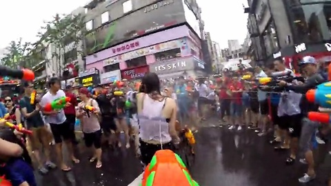 Massive water gun fight on the streets of Seoul, South Korea